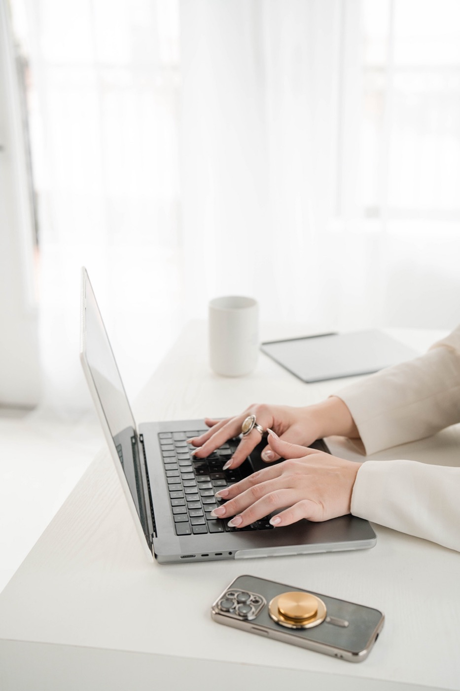 Practitioner working on laptop